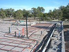 Photo of radiant heating coils in a concrete slab